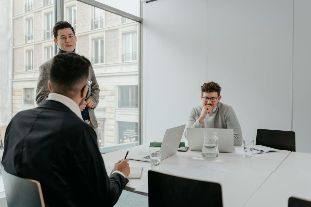 A Group of Businessmen Having Conversation Inside the Conference Room