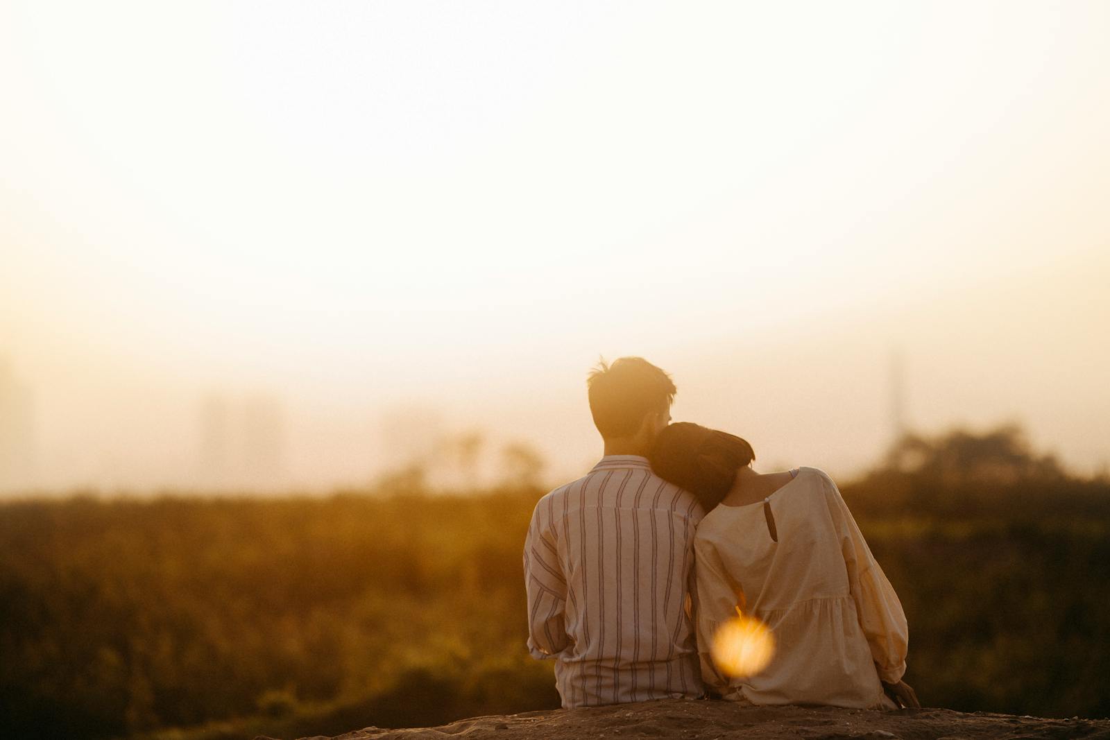 A couple enjoys a serene moment together during a sunset in Gia Lai, Vietnam.