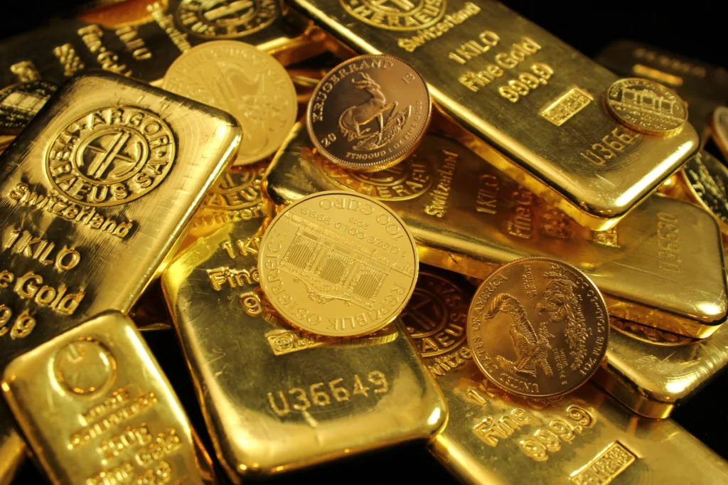 close up photo of gold bars and coins
